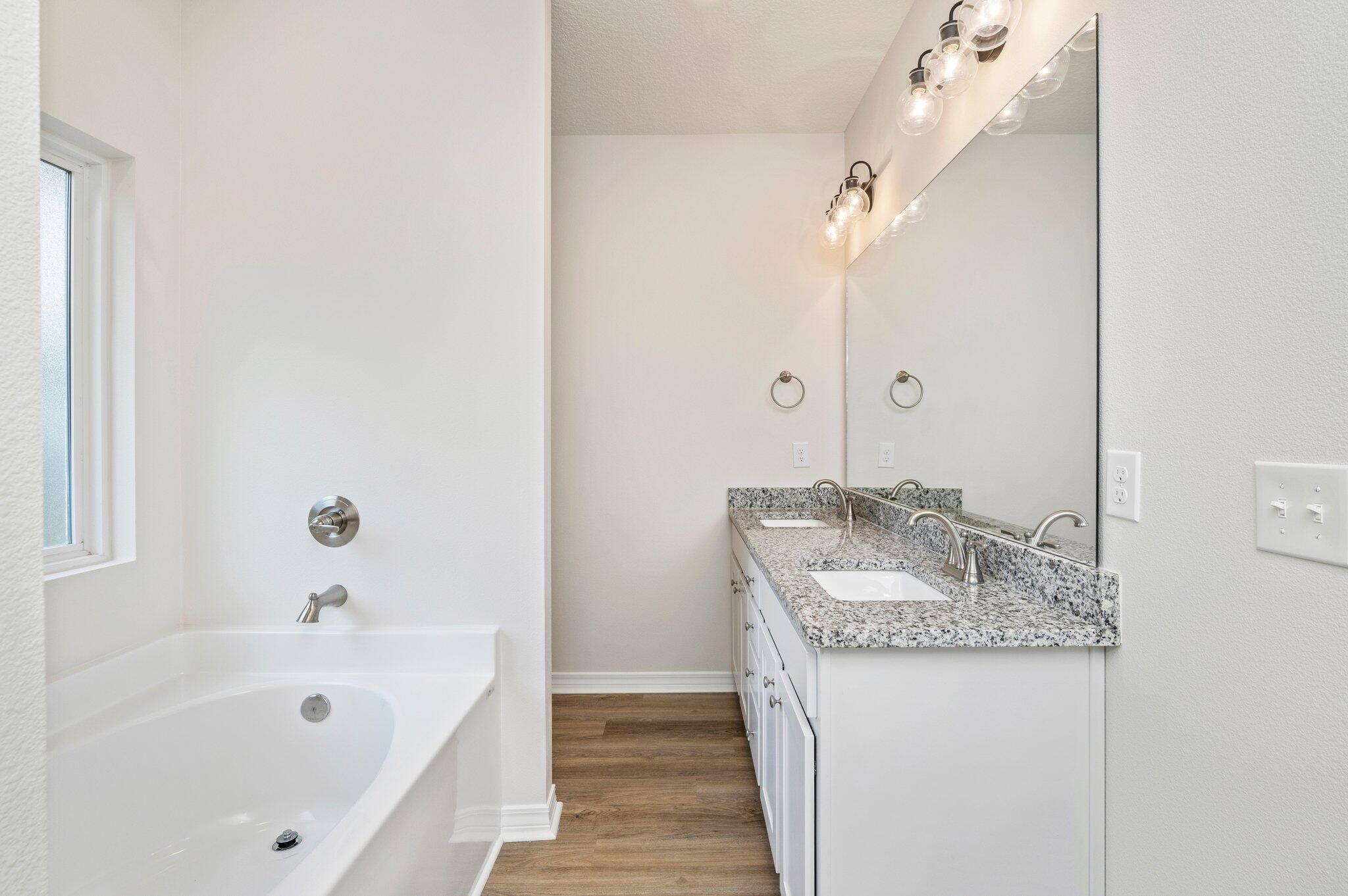 3156 Forrest Avenue Crestview, FL 32539 - Photo 24 of 44 a bathroom with a granite countertop sink and a mirror