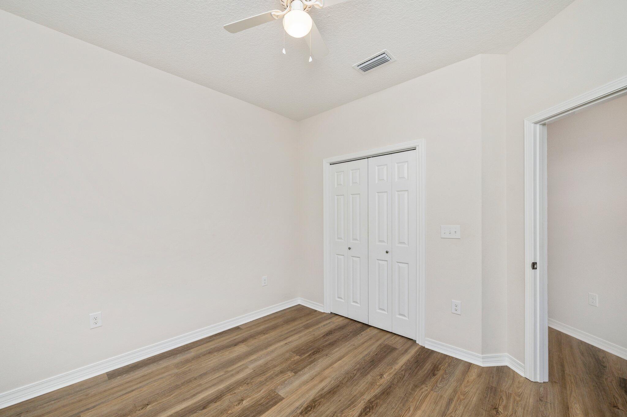3156 Forrest Avenue Crestview, FL 32539 - Photo 33 of 44 a view of an empty room with wooden floor