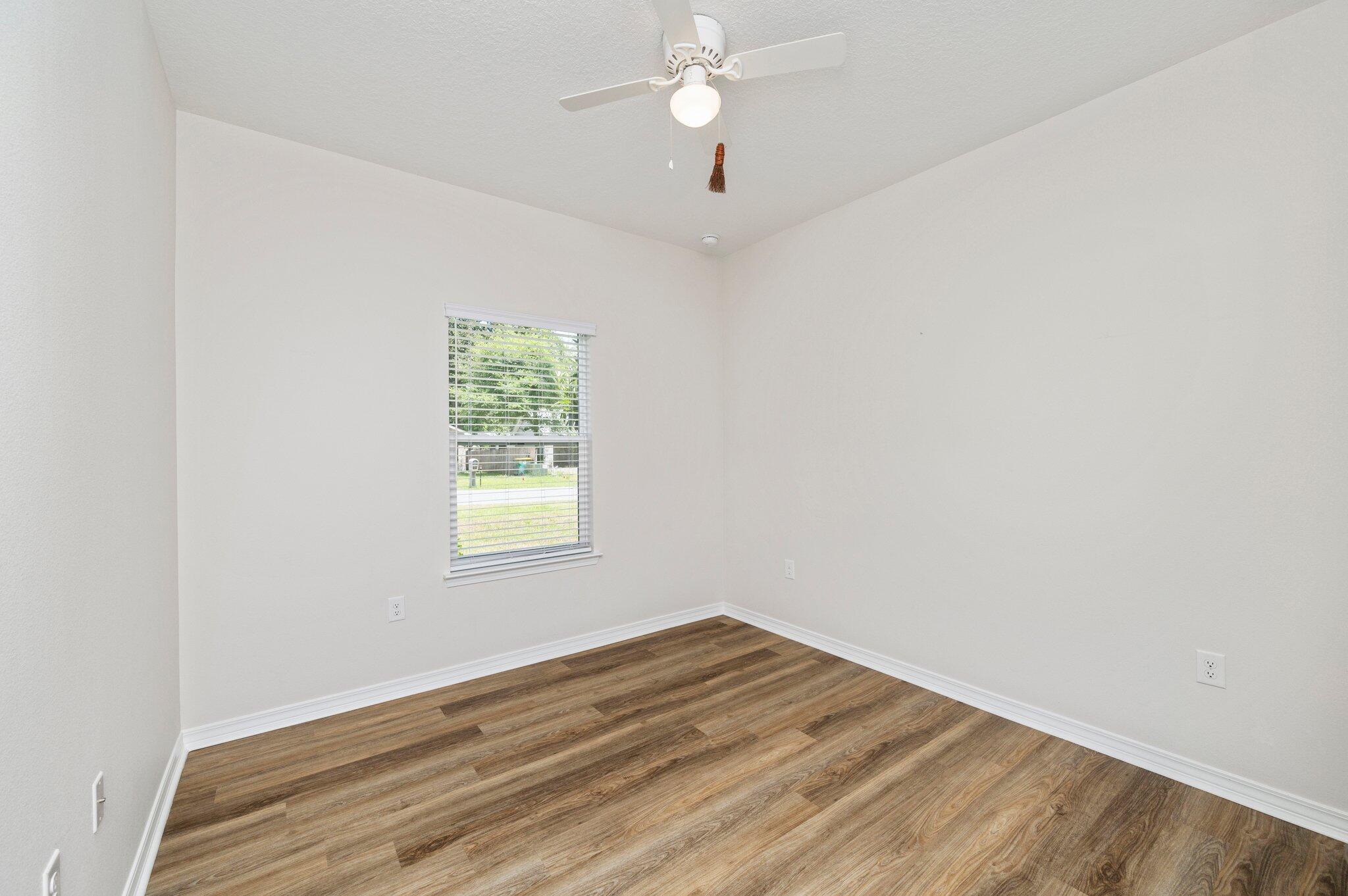 3156 Forrest Avenue Crestview, FL 32539 - Photo 34 of 44 an empty room with a window and a fan