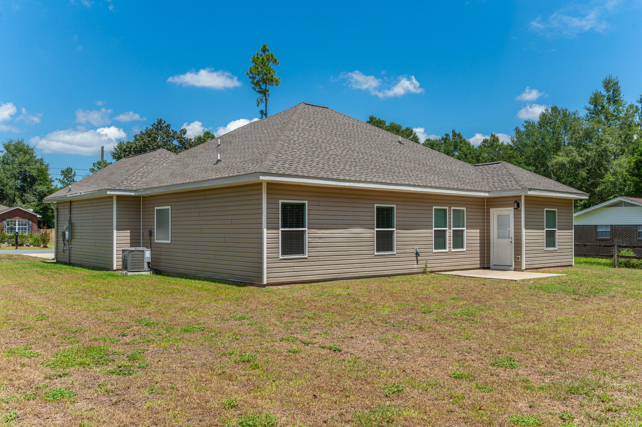 3156 Forrest Avenue Crestview, FL 32539 - Photo 40 of 44 a front view of house with yard and trees in the background
