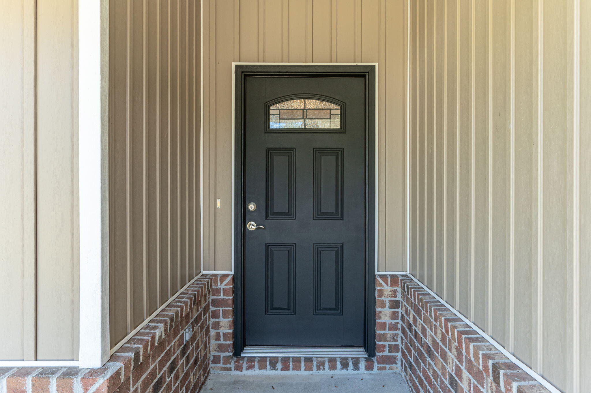 3156 Forrest Avenue Crestview, FL 32539 - Photo 4 of 44 a view of a hallway with wooden door