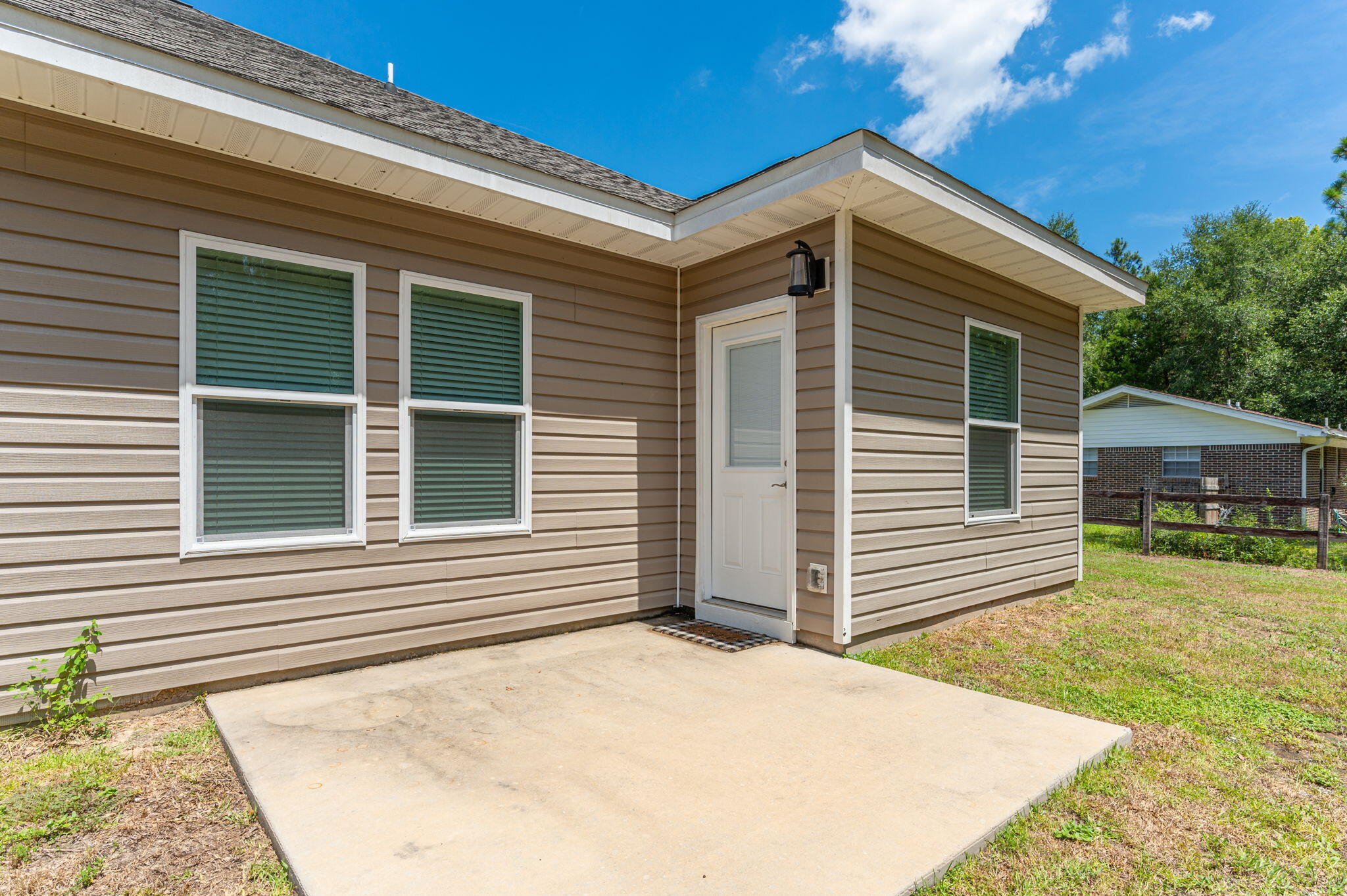 3156 Forrest Avenue Crestview, FL 32539 - Photo 41 of 44 a front view of a house with a yard