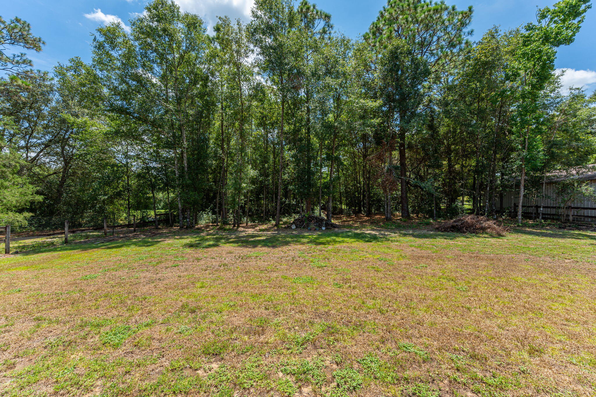 3156 Forrest Avenue Crestview, FL 32539 - Photo 42 of 44 a view of a swimming pool with trees in the background