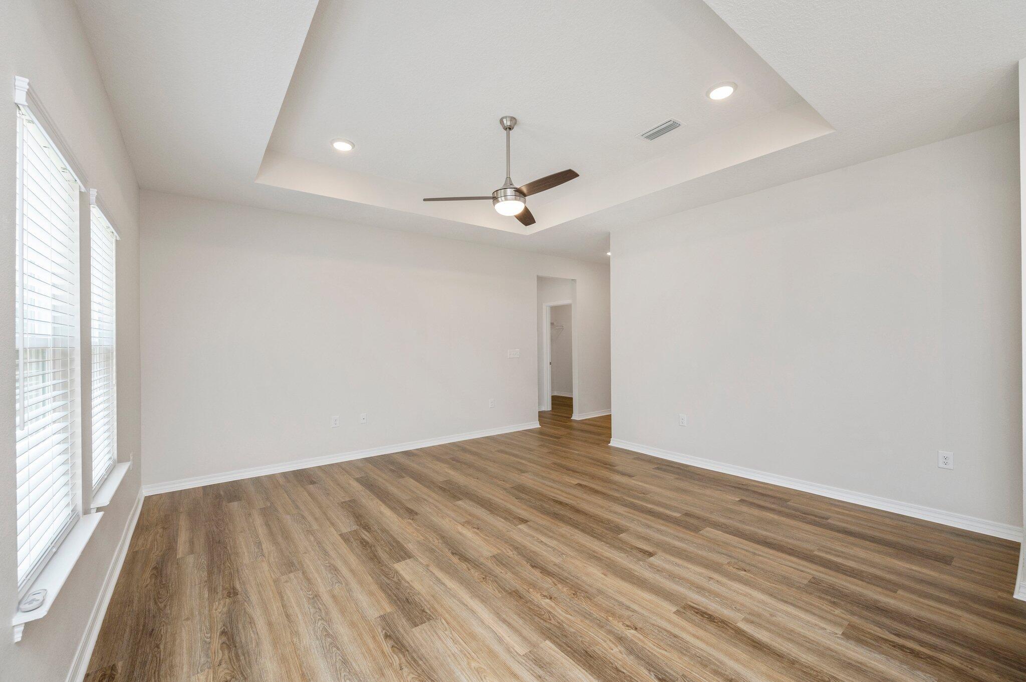 3156 Forrest Avenue Crestview, FL 32539 - Photo 10 of 44 wooden floor in an empty room with a window