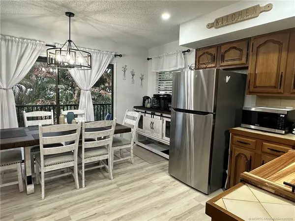 a view of a garden with a tree in the garden