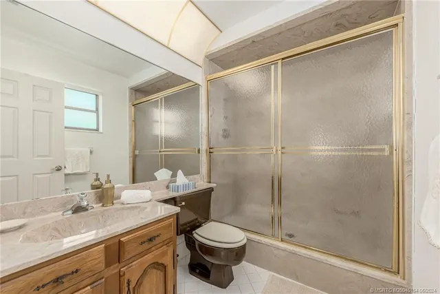 a view of a balcony with a table and chairs