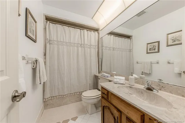 a view of a lake with chairs