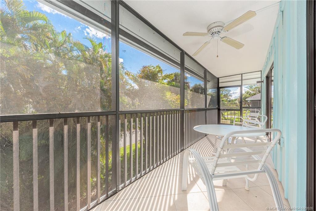 4095 Southeast Centerboard Lane, Unit 6B Stuart, FL 34997 - Photo 44 of 83 a view of a glass door with a balcony