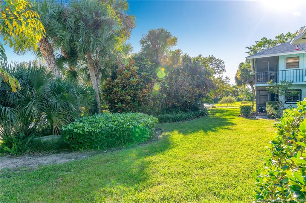 4095 Southeast Centerboard Lane, Unit 6B Stuart, FL 34997 - Photo 49 of 83 a view of a house with a yard