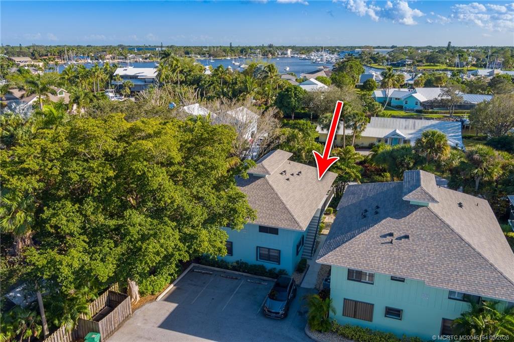 4095 Southeast Centerboard Lane, Unit 6B Stuart, FL 34997 - Photo 50 of 83 an aerial view of a house with a yard and lake view