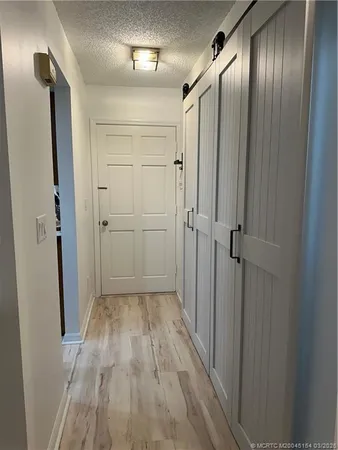 a kitchen with stainless steel appliances granite countertop a sink table and chairs