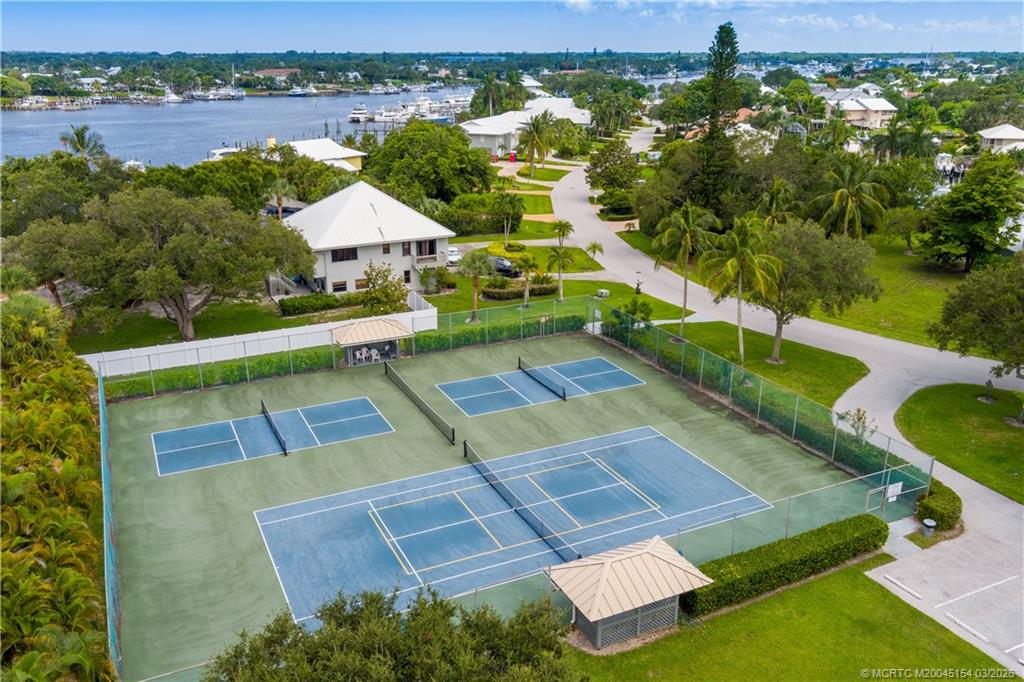 4095 Southeast Centerboard Lane, Unit 6B Stuart, FL 34997 - Photo 74 of 83 an aerial view of residential house with outdoor space and lake view