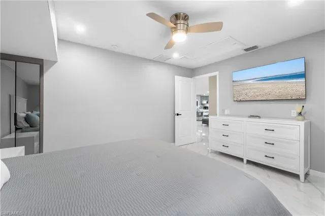 a view of room with cabinet and mirror