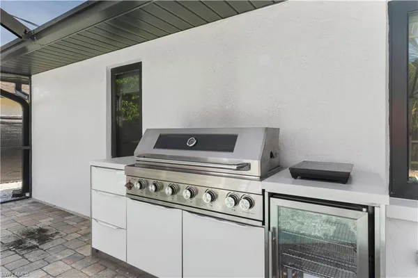 a stove top oven sitting inside of a kitchen