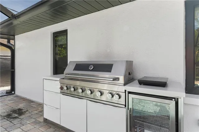 a stove top oven sitting inside of a kitchen