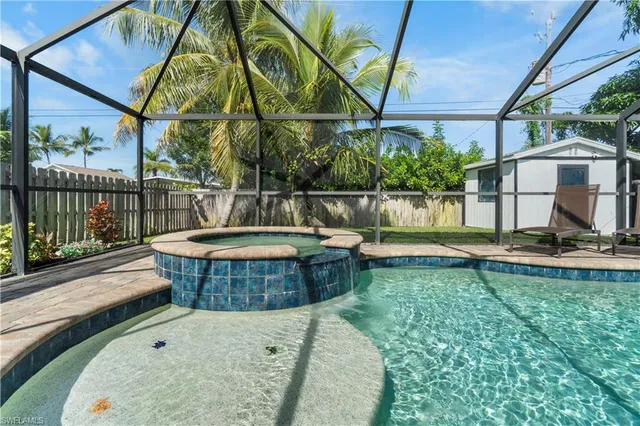 a view of a swimming pool with a patio
