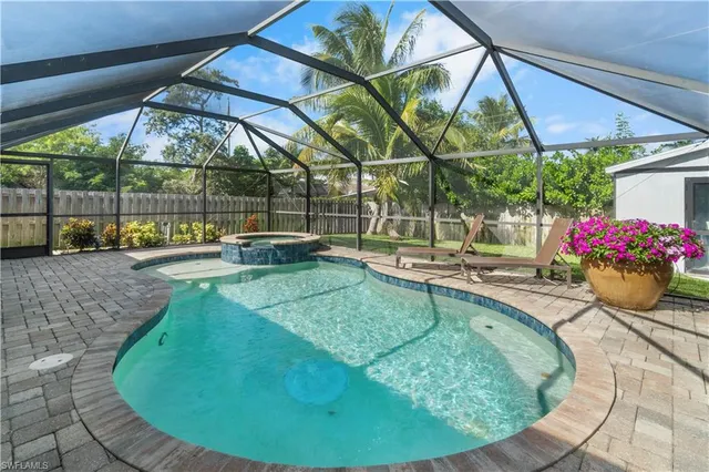 a view of a swimming pool with a patio