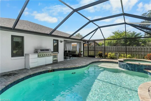 a view of a backyard with sitting area