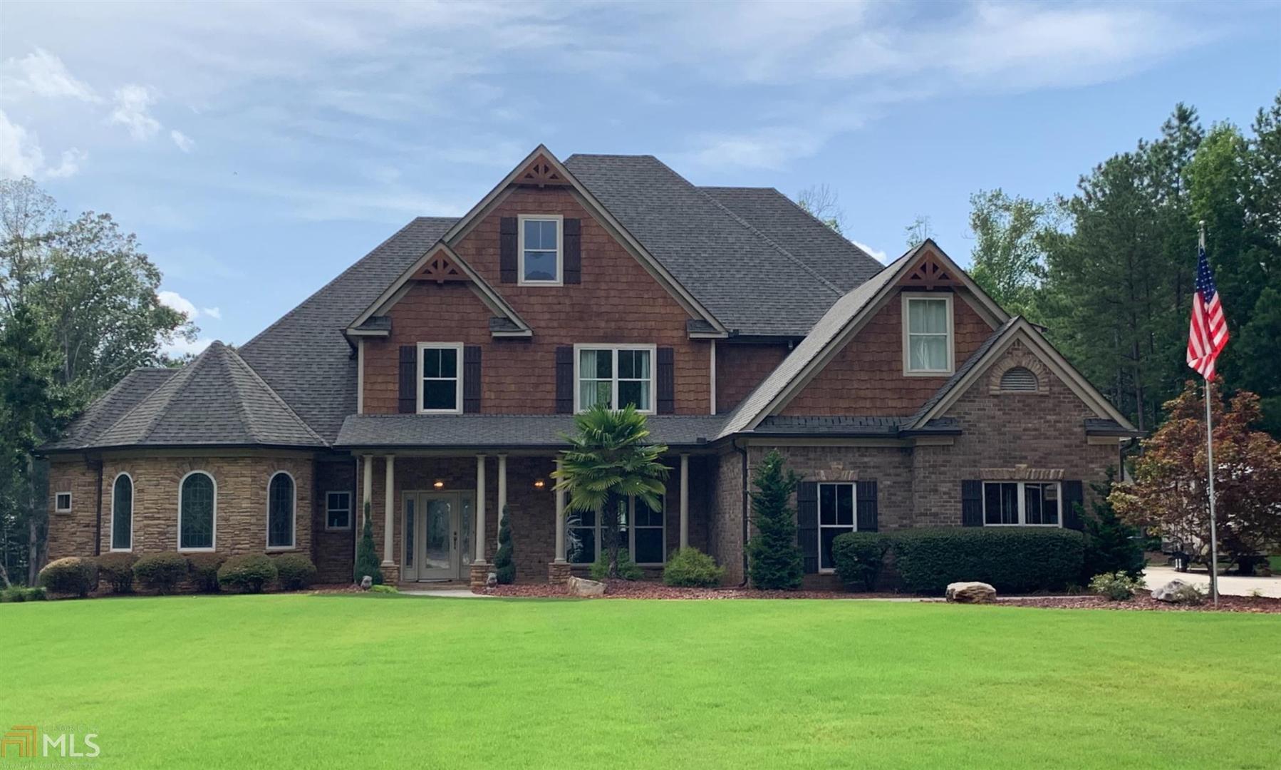 290 Sowell Road McDonough, GA 30252 - Photo 1 of 1 a front view of a house with a yard