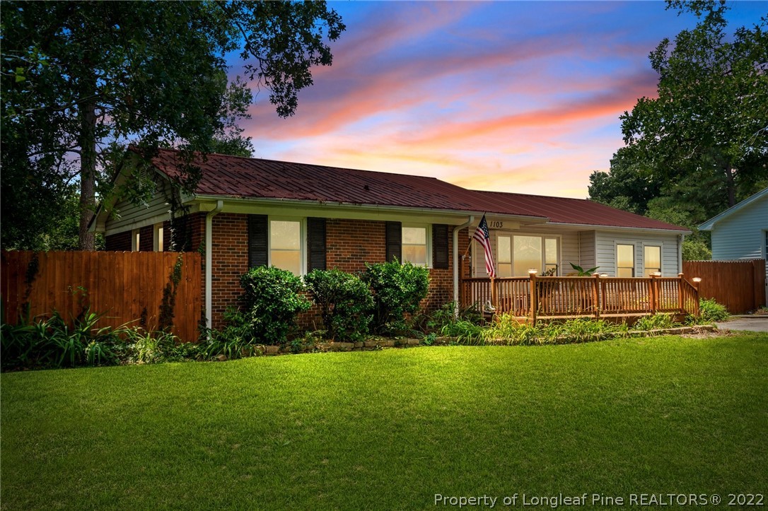 1103 Vass Road Spring Lake, NC 28390 - Photo 1 of 37 a front view of house with yard and green space