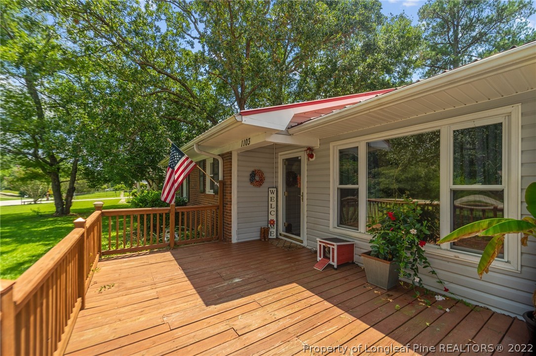 1103 Vass Road Spring Lake, NC 28390 - Photo 14 of 37 a view of a deck with a yard