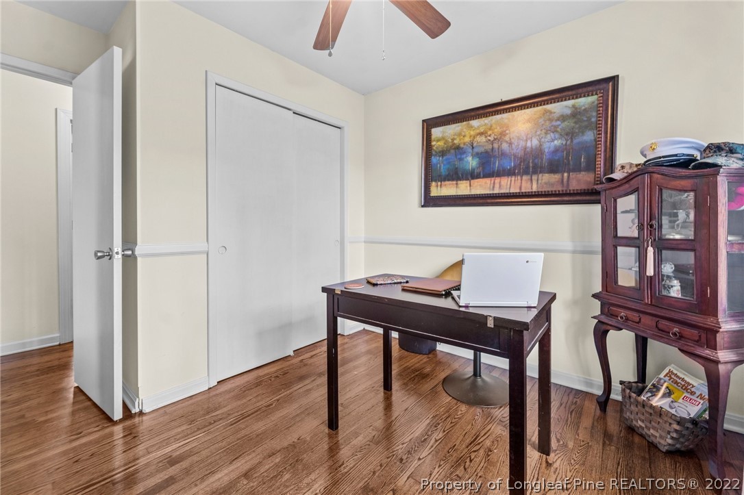 1103 Vass Road Spring Lake, NC 28390 - Photo 21 of 37 a view of a workspace with furniture and wooden floor