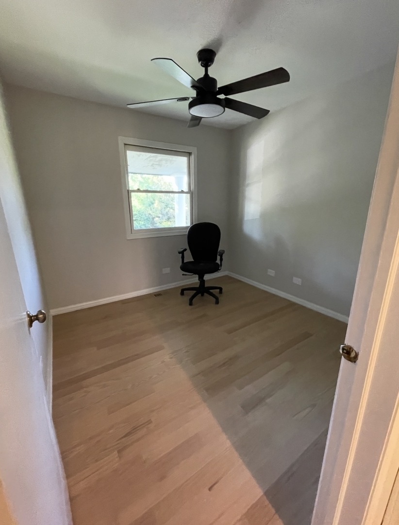 1703 Winnetka Road Northfield, IL 60093 - Photo 8 of 10 a room with a window and a ceiling fan