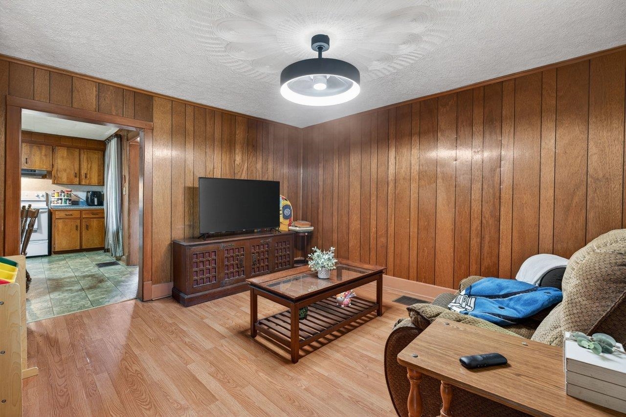 724 Newtown Road Elkton, VA 22827 - Photo 11 of 38 a living room with furniture and wooden floor