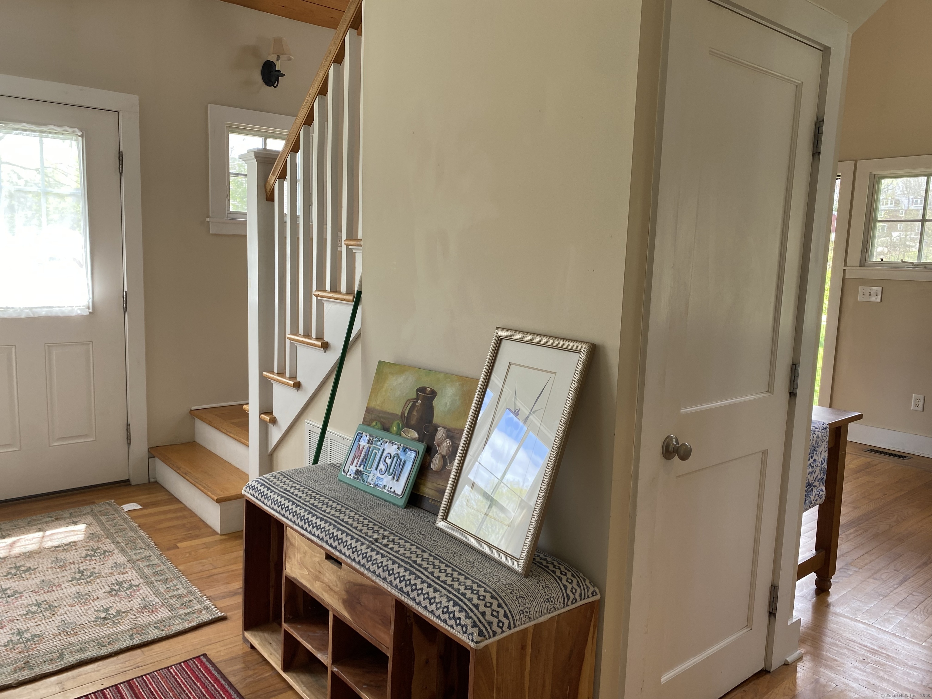 33 Copse Road, Unit B Madison, CT 06443 - Photo 3 of 16 a view of an entryway with wooden floor