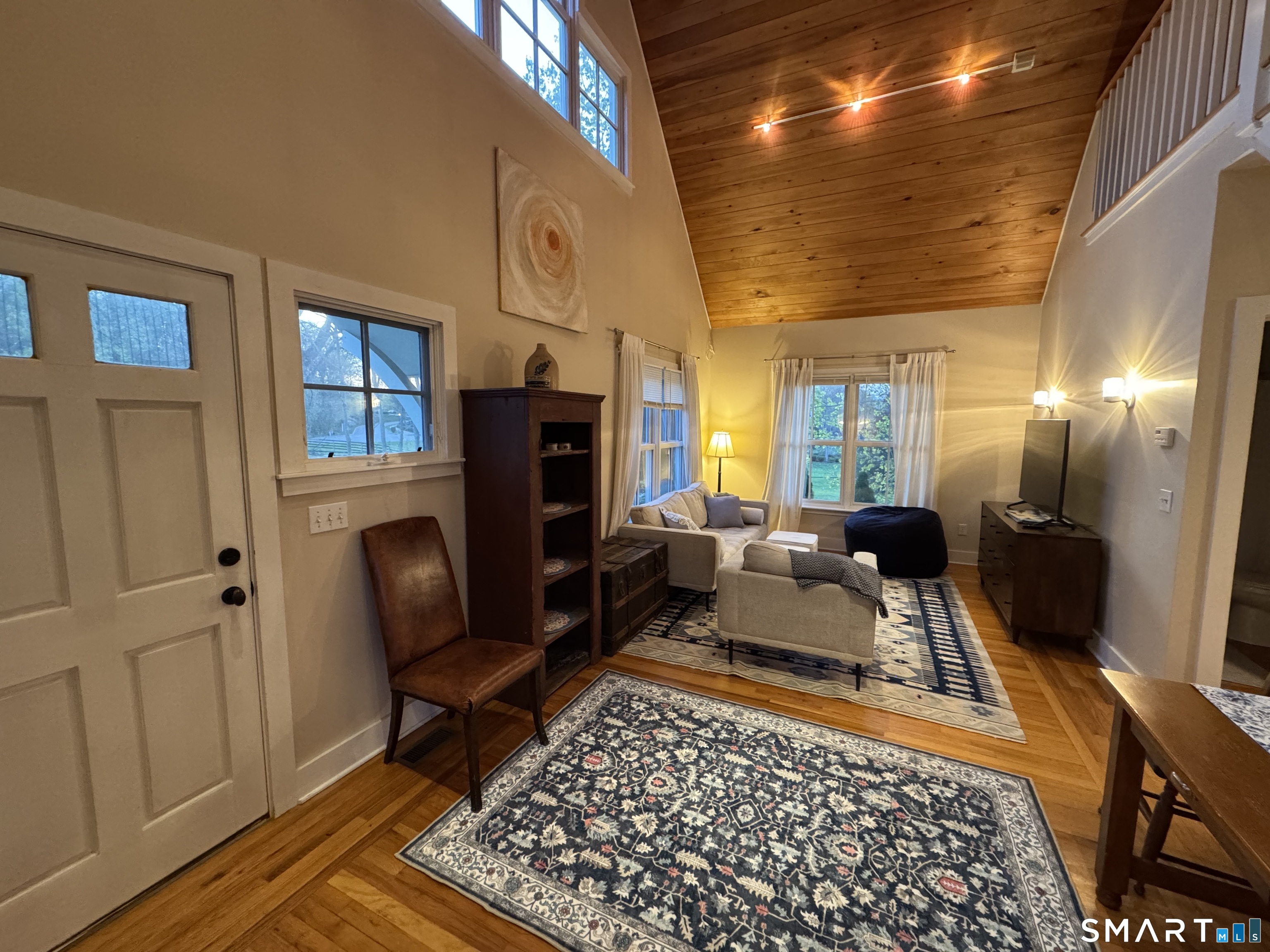 33 Copse Road, Unit B Madison, CT 06443 - Photo 5 of 16 a living room with furniture rug and a fireplace
