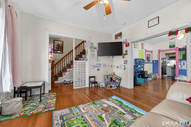 a living room with furniture and a flat screen tv