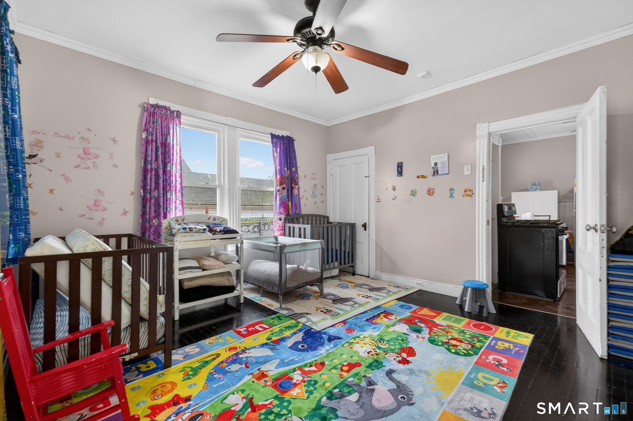 4 Robbins Court Norwich, CT 06360 - Photo 15 of 26 a room with furniture a baby crib and a window