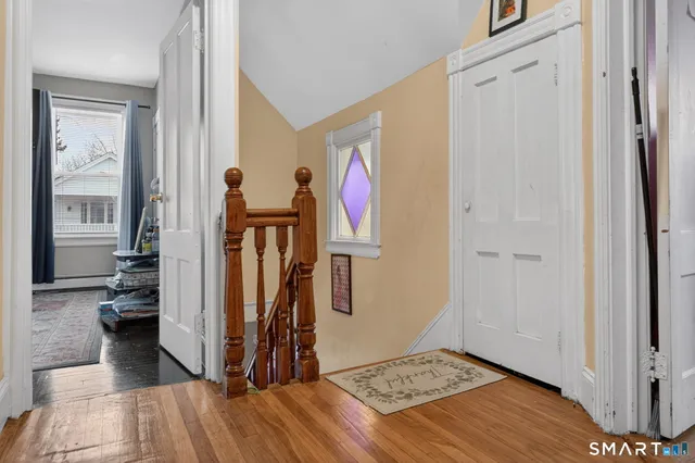 a view of a livingroom with furniture and windows