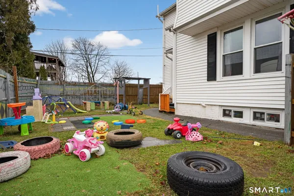 a play ground with lots of white chairs