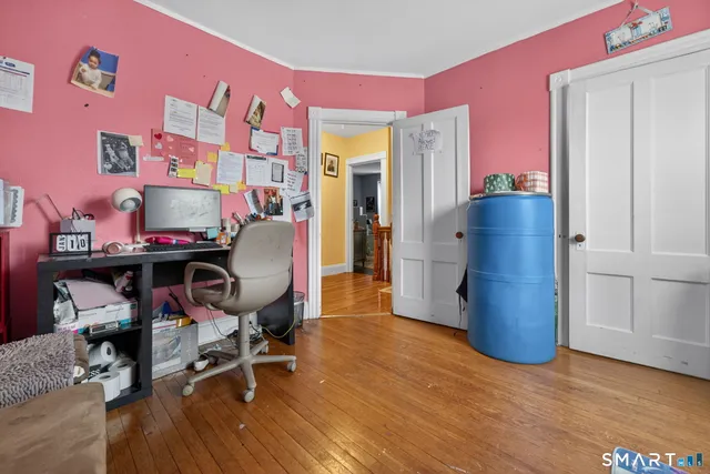 a workspace with furniture and wooden floor
