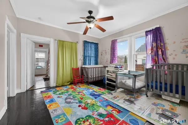 a room that has a bed and a table in it