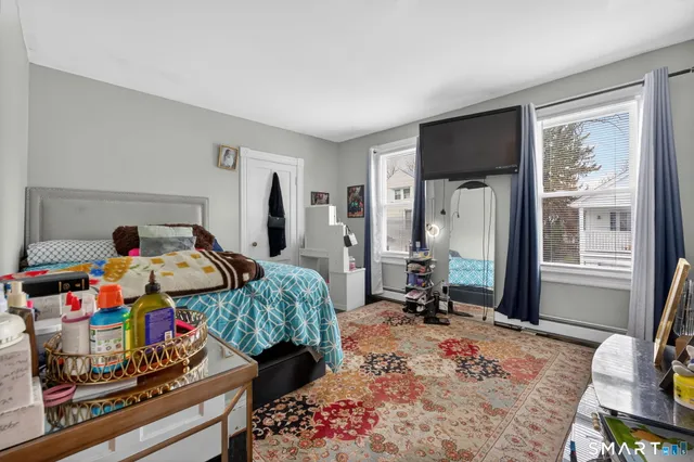 a bed room with furniture and a window