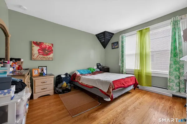 a room with a bed and a window