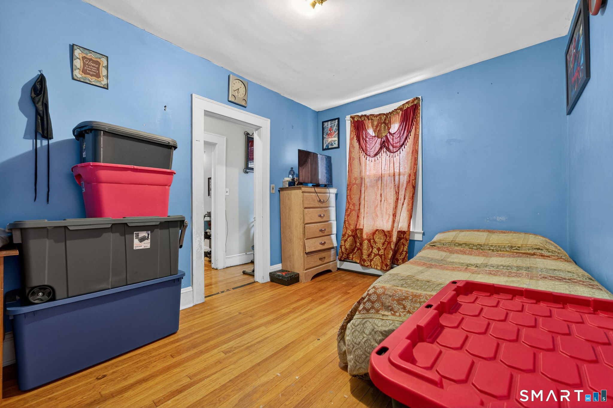 4 Robbins Court Norwich, CT 06360 - Photo 23 of 26 a bedroom with a bed and wooden floor