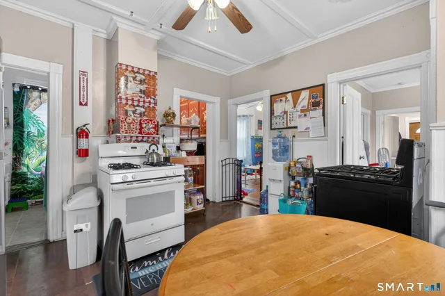 a kitchen with a stove a refrigerator and a stove