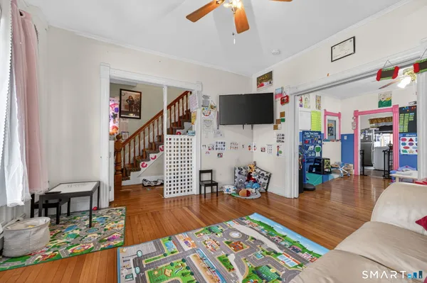 a living room with furniture and a flat screen tv
