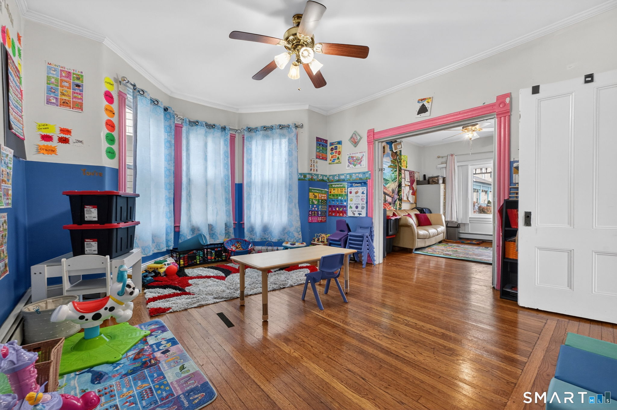 4 Robbins Court Norwich, CT 06360 - Photo 9 of 26 a living room with furniture and a chandelier