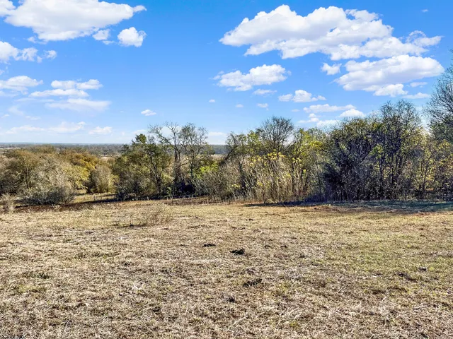 an aerial view of beach with ocean view