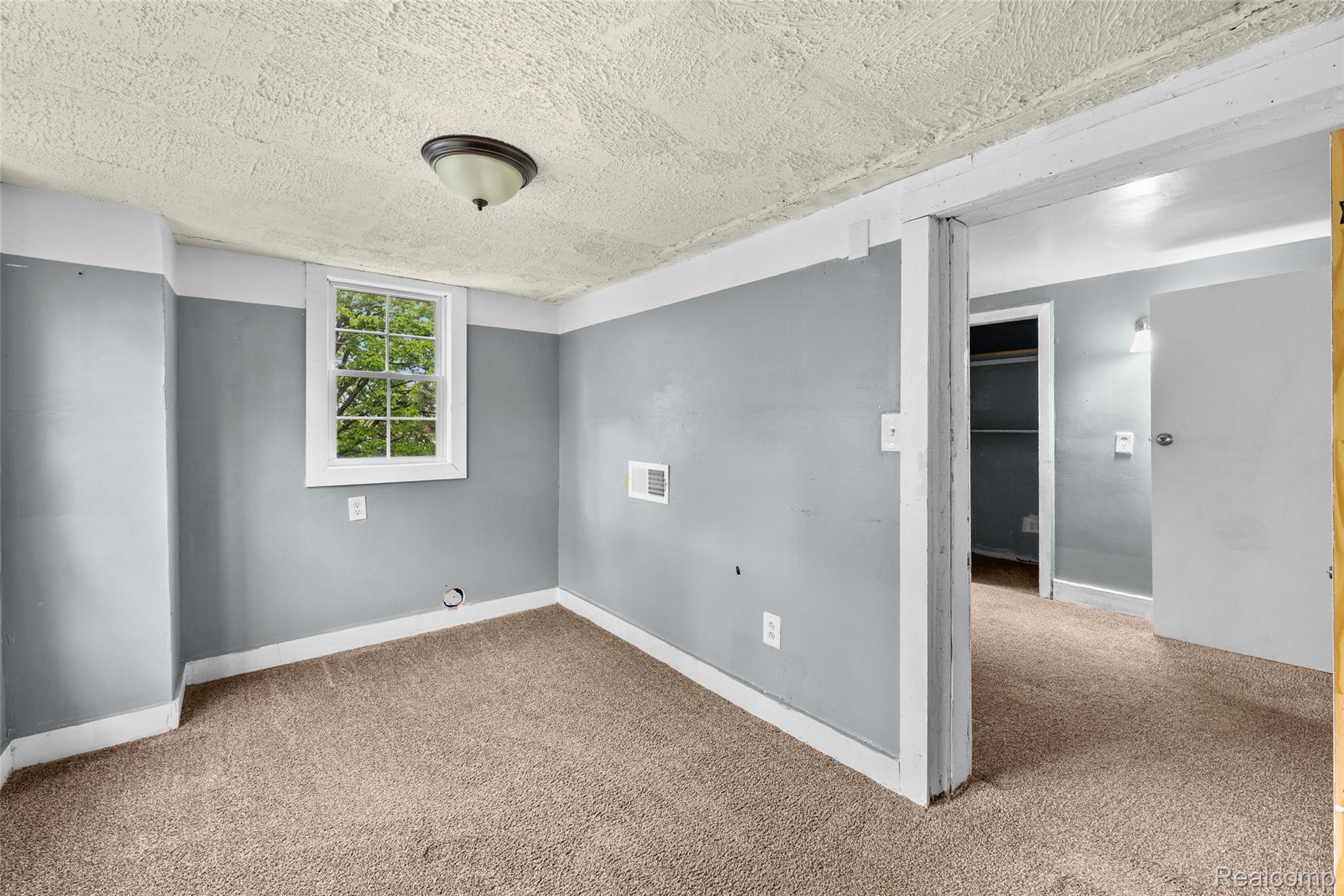 3605 Ash Street Inkster, MI 48141 - Photo 22 of 25 Spare room featuring light carpet and a textured ceiling