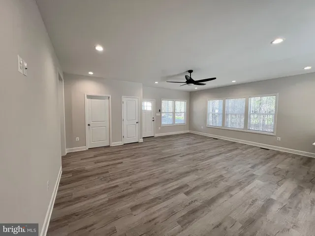 a kitchen with a sink appliances and cabinets