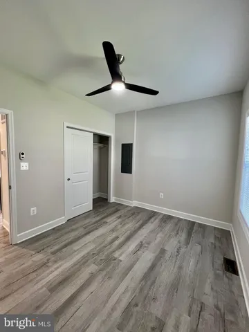 a view of a lake with a house in the background