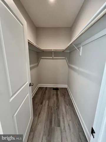 a view of a lake with houses in the back