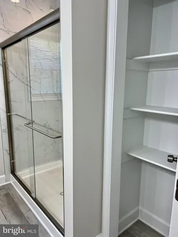 a view of a lake with a house in the background