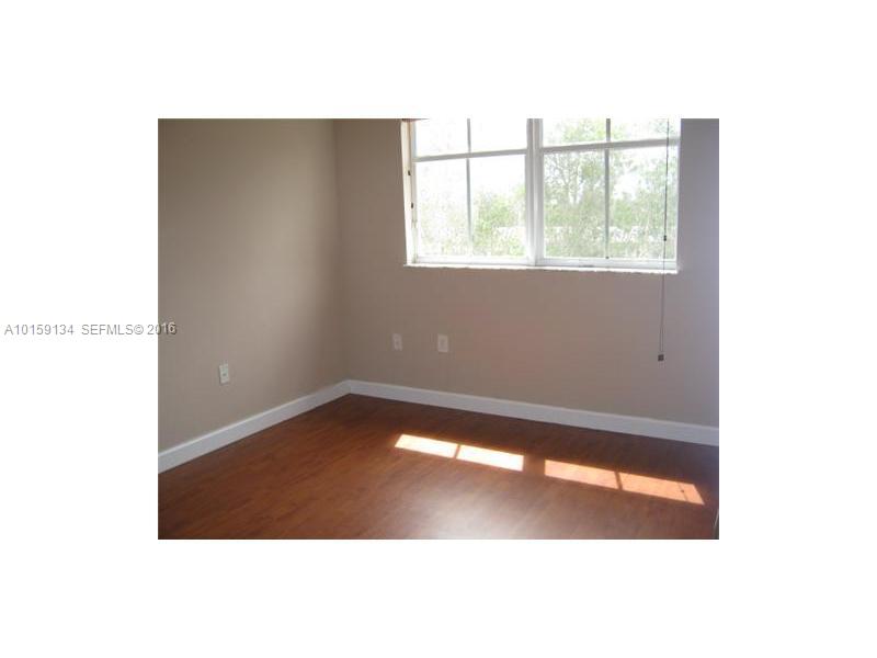 15480 Southwest 284th Street, Unit 2207 Homestead, FL 33033 - Photo 12 of 12 a view of an empty room with a window