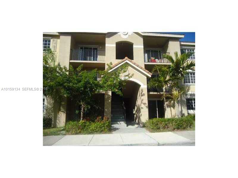 15480 Southwest 284th Street, Unit 2207 Homestead, FL 33033 - Photo 2 of 12 a front view of a house with a yard